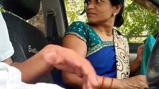 Wife performs oral sex in automobile