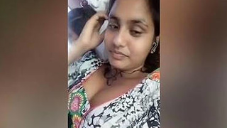 A South Asian woman reveals her cleavage during a chat