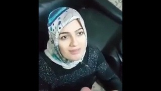 An aunt in a hijab performs oral sex