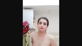 Indian wife showcases her large breasts and indulges in self-pleasure