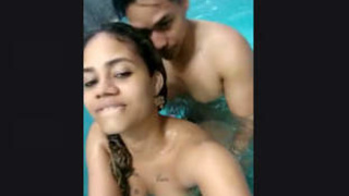 Indian couples engage in poolside intimacy