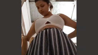 A seductive Indian woman displays her breasts