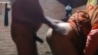 Middle-aged Indian woman engages in doggy style sex in rural setting