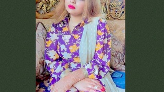 A stunning young woman seductively displays her lovely breasts