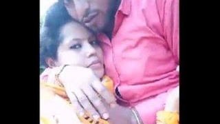 An enticing Indian girl with large breasts pleasures her partner with a sensual outdoor blowjob