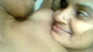 Arousing encounter of a young woman and Indian man engaging in sexual activity