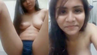 A South Asian woman masturbates in a sensual video using her fingers