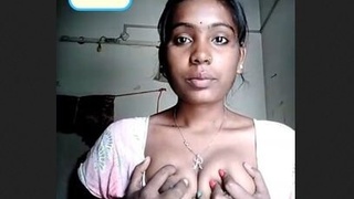 A sultry video featuring an Indian beauty revealing her ample bosom