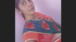 An Indian college girl proudly displays her large breasts in an adorable video