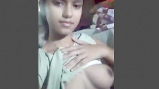 A solo Indian girl reveals her large breasts and intimate area