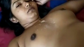 A stunning young woman delivers a passionate titjob and gets covered in cum