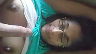 Indian girlfriend with large breasts performs oral sex