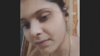 Indian beauty reveals cleavage in seductive display