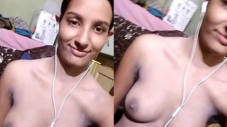 An attractive Indian woman reveals her breasts and vagina