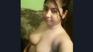 A stunning Indian woman bathes in this video