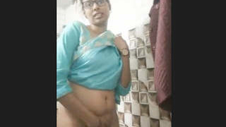 Indian beauty reveals and engages in intimate acts in video