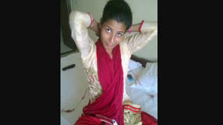 Indian escort in a hotel bedroom