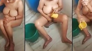 Slutty shower Desi aunt nude bathes in the open air secretly recorded on MMS by her son
