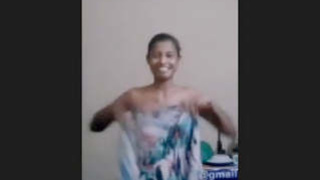A Sri Lankan woman proudly displays her large breasts