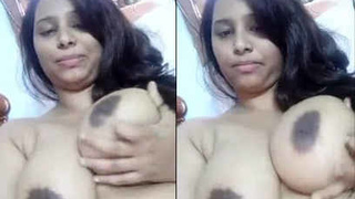Indian office girl with large breasts puts on a show