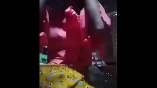 A young village Desi woman with a large vagina engages in explicit activities