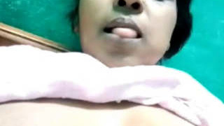 Aroused older woman pleasuring herself