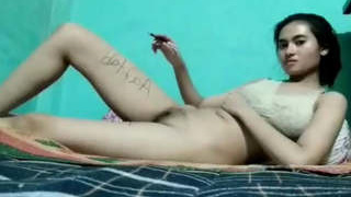 A stunning girl from Assam inks her lover's name on her legs