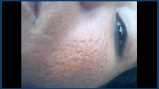 Mature Indian woman engages in outdoor intimate encounter in blue field