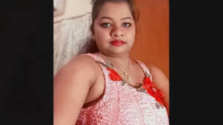 South Asian mature woman with large breasts displays and stimulates her moist vagina