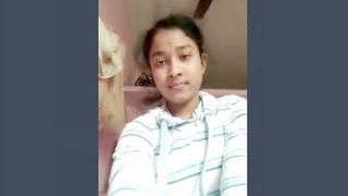 Adorable girl displays her breasts and vagina in a video