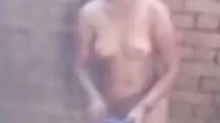 Desi in an outdoor shower, captured by a voyeuristic neighbor