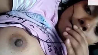 An attractive Indian babe fondles her lovely breasts