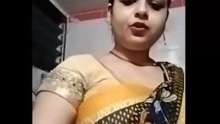 Sensual sari-clad Indian woman pleasuring herself with Julie