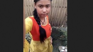 Young village girl takes a bath
