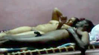 Indian couple unwinds in the nude on the bed after sexual encounter