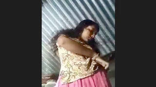 Village woman reveals her voluptuous figure in an erotic video