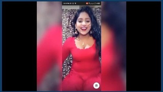 A seductive tango performance with a woman's breasts touching