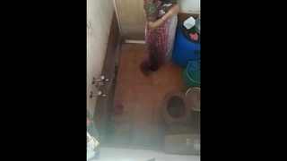 A Tamil wife from the south removes her pubic hair in the bath