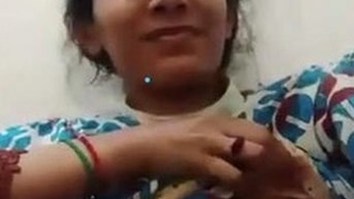 A charming girl displays her breasts on video call