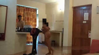 An Indian woman misbehaves with the room service attendant while being completely nude