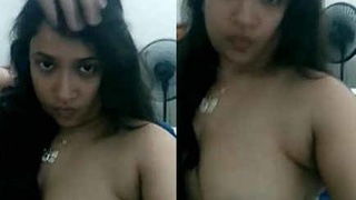 Young Indian college girl reveals her breasts in a recorded video