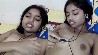 Indian teen bares it all on the bed, indulging in self-pleasure