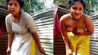 Stunning Bangladeshi woman takes a relaxing bath in the village