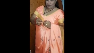 Mature Indian woman in lingerie performs sensual oral sex