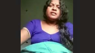 Aroused Tamil housewife displays her breasts and intimate area